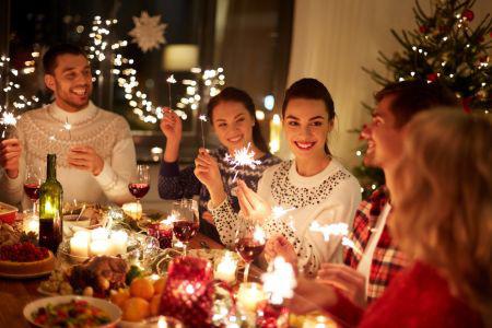 group of people sitting around the dinner table