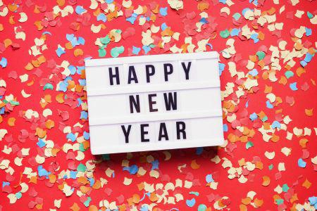 Red background with the words with Happy New Year