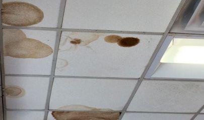 Water Damage From an Under Sink Cabinet Bathroom Leak