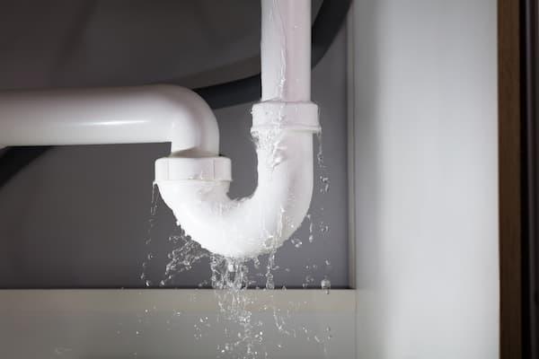 A plumbing pipe leaking water