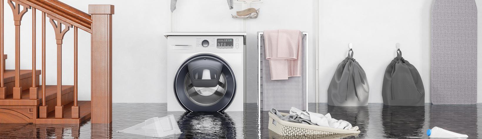 A flooded basement with a washing machine