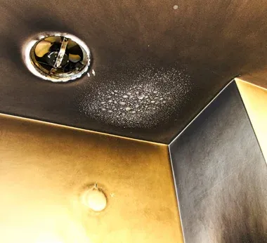 A ceiling with fire damage