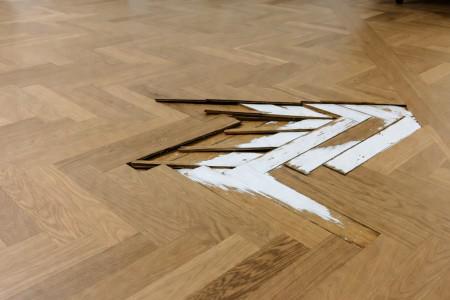 Hardwood floor water damage: When to repair vs. replace and what it costs