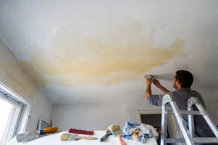 How to fix a water stained ceiling: DIY vs. professional