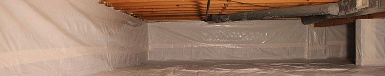 Moisture barrier installation on a basement wall.
