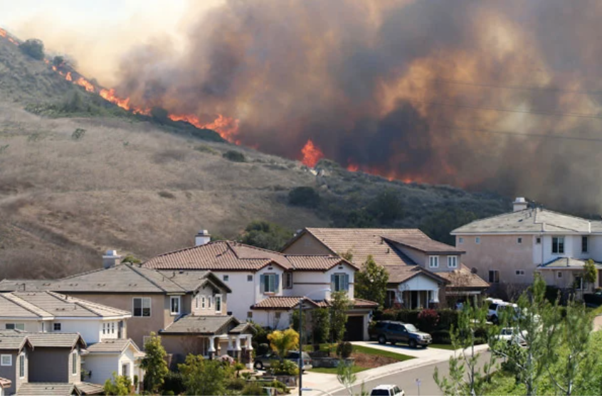 Wildfire by houses