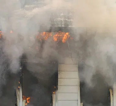 A building on fire with smoke