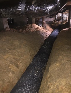 Drainage pipe in crawlspace