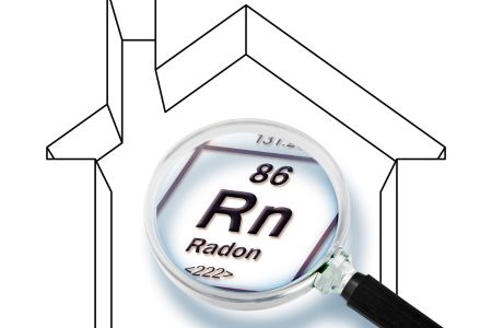 outline of a home with a magnifying glass over the letters Rn